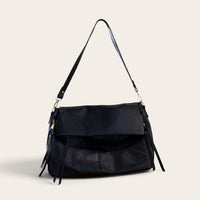 Harlow Slouch Bag in black PU leather - front view, fold-over flap