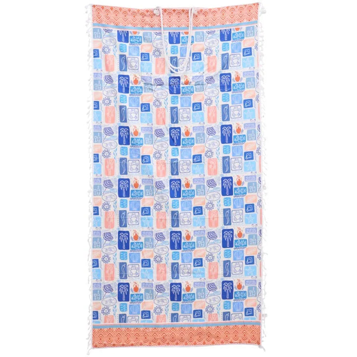 Colourful microfibre beach towel with blue and pink tropical palm tree and beach umbrella print on white background, perfect for summer travel and beach days