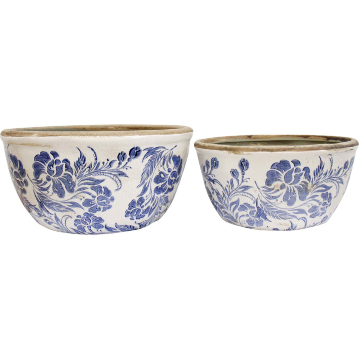 Two ceramic bowls with blue floral patterns on a white background
