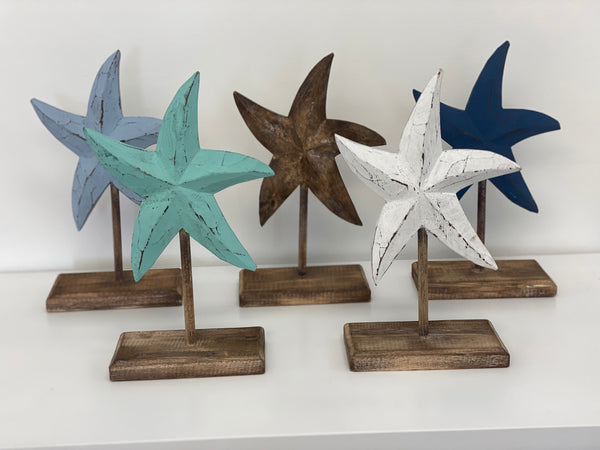 Wooden starfish sculptures on stand