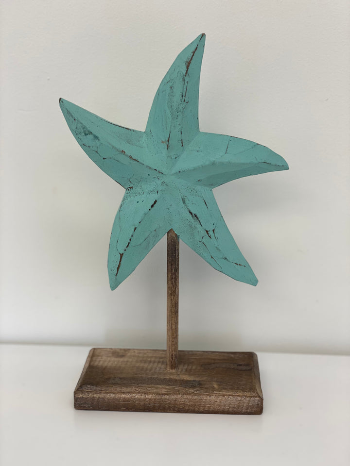 Aqua wooden starfish sculpture on stand