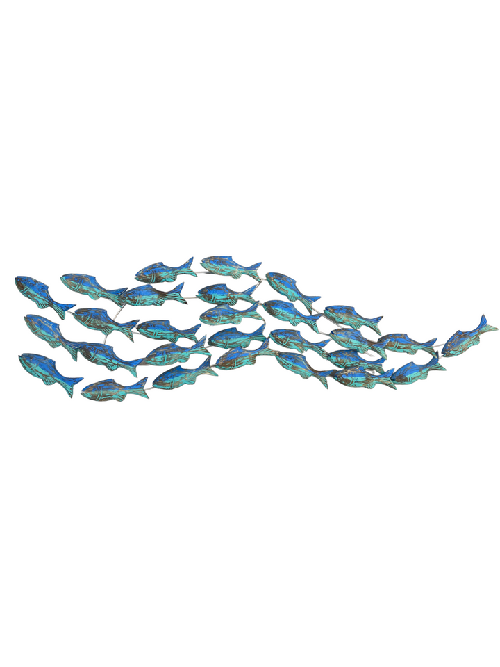 A handcrafted wooden fish wall hanging, depicting a school of fish, mounted on a white wall.