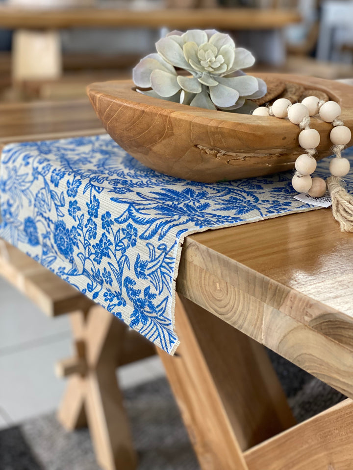 a blue floral table runner with neutral coloured background