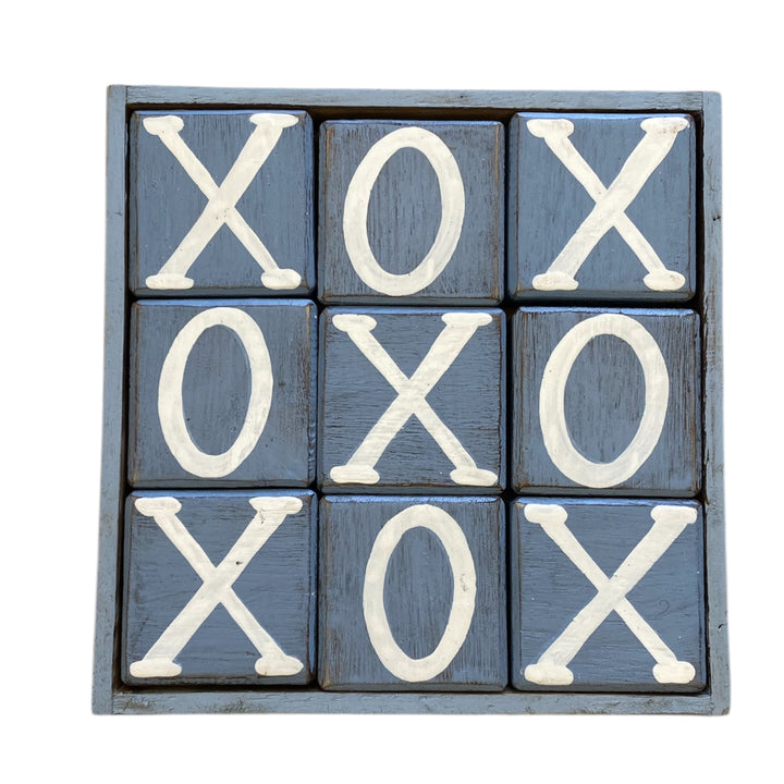 Wooden blocks with X and O symbols on a white background