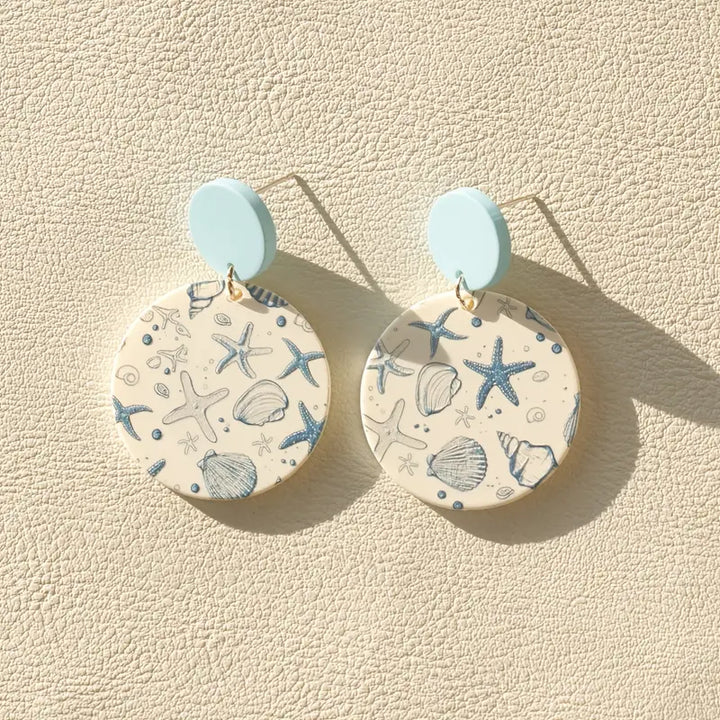 Blue and white earrings with starfish and shell print – ocean-inspired design