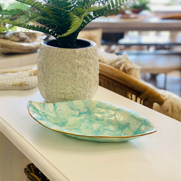 Decorative shell bowl with marbled pattern for entertaining.