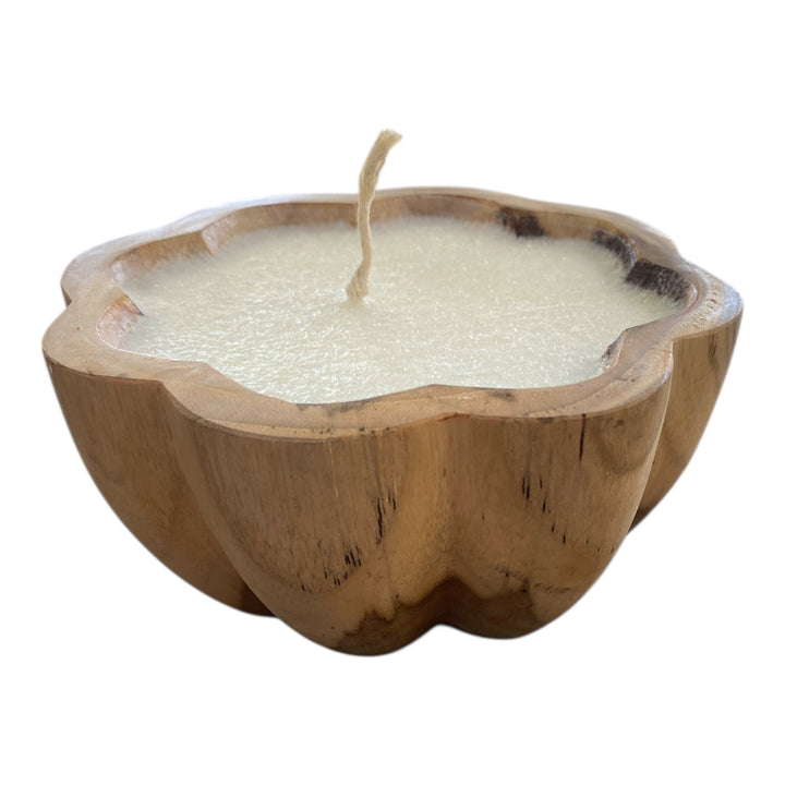 decorative candle in teak timber vessel