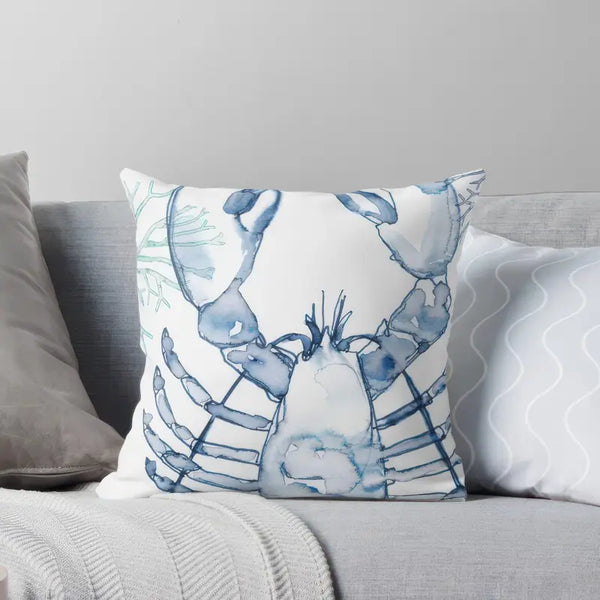 Blue and aqua throw pillow with marine-inspired coral and lobster design