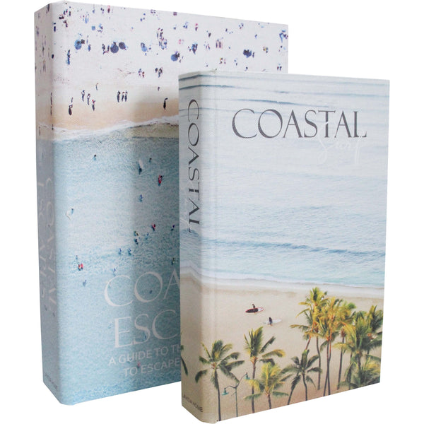 book-shaped storage boxes with a coastal theme, one depicting a beach scene with palm trees and the other with a general ocean waves and beach horizon design.