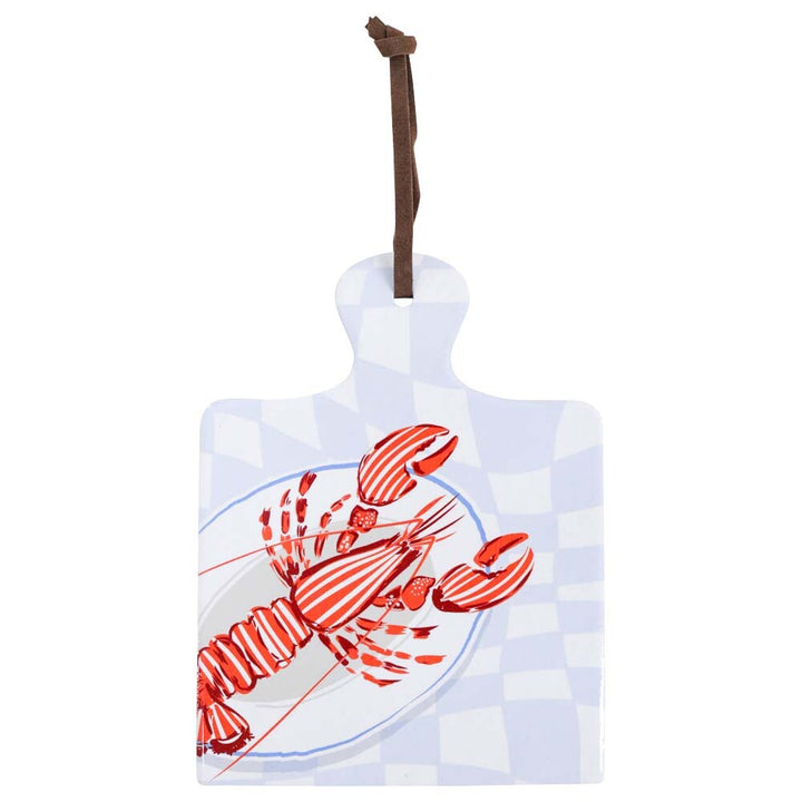 decorative trivet with lobester/crayfish print in vibrant red with pastel blue background.