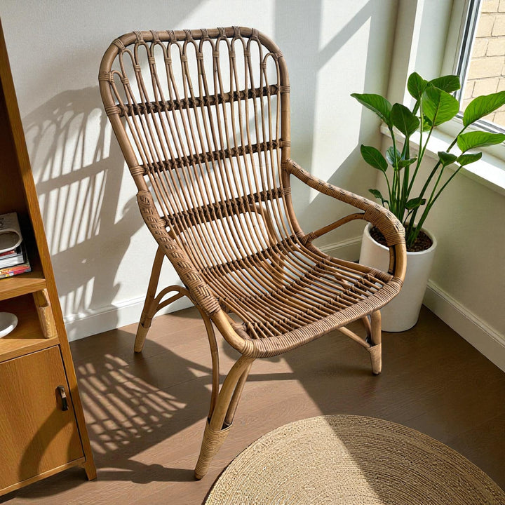 Elegant antique glazed rattan chair with natural texture and a relaxed, lightweight frame