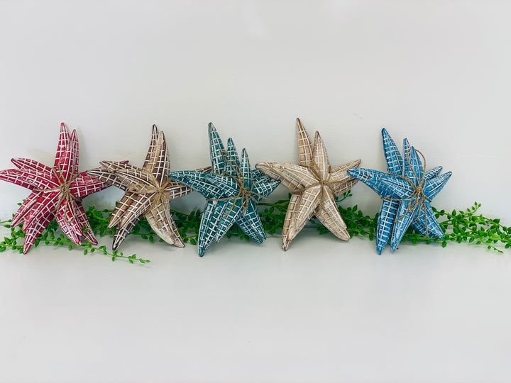 Decorative starfish on a white background with greenery