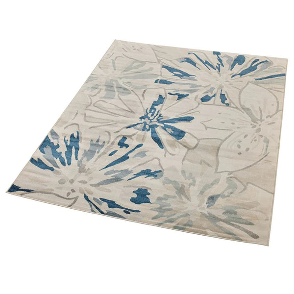 Floral patterned rug with blue and beige colors on a white background