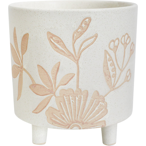 A beige ceramic planter with a floral pattern and a matte finish.