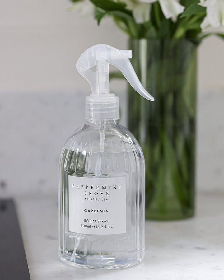 gardenia room spray in a clear plastic bottle