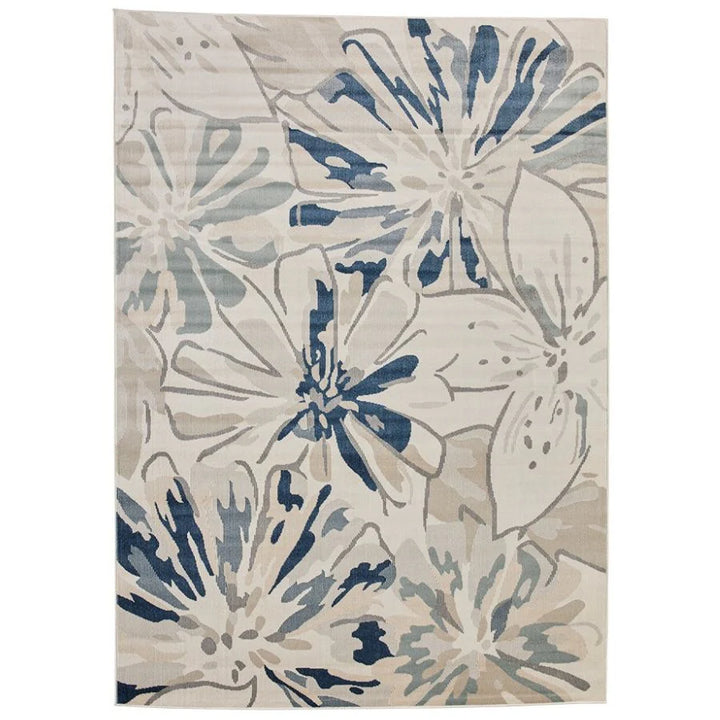 Floral patterned rug with blue and beige colors on a white background