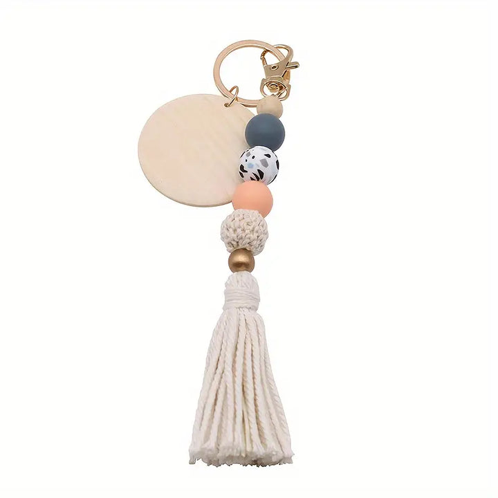 Keychain with beads and tassel on a white background
