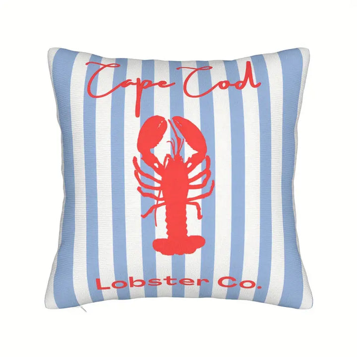 Blue and white nautical stripe cushion with red lobster design, perfect for coastal and beach house styling