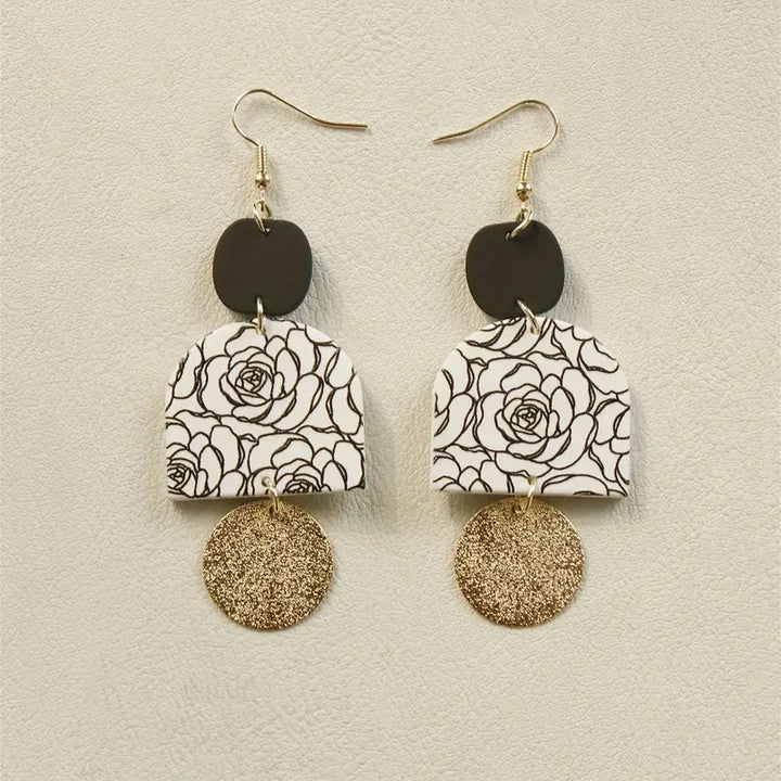 Black and white floral drop earrings with gold textured disc and black stud top