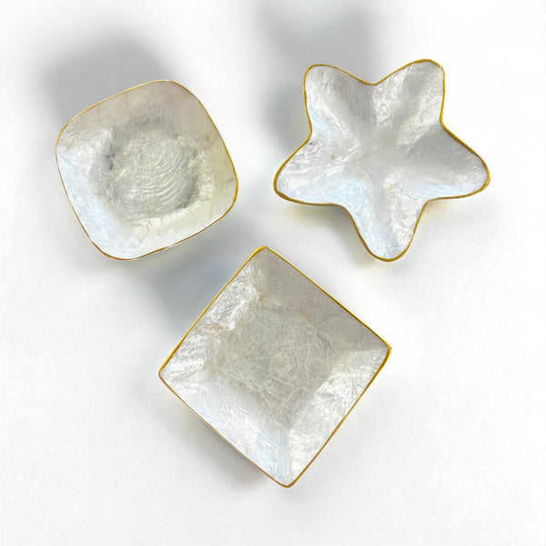 Star, square and square round shaped mini trinket dish styled with rings and earrings – coastal home décor inspiration