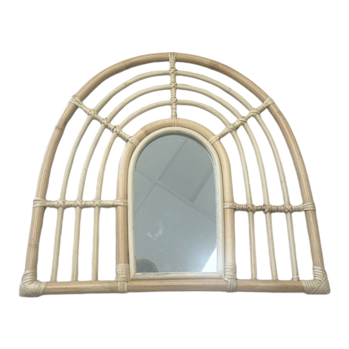 a natural arch shaped cane mirror