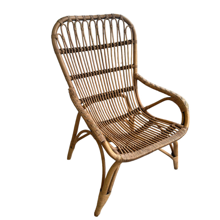 Handwoven cane armchair showcasing natural texture and timeless appeal