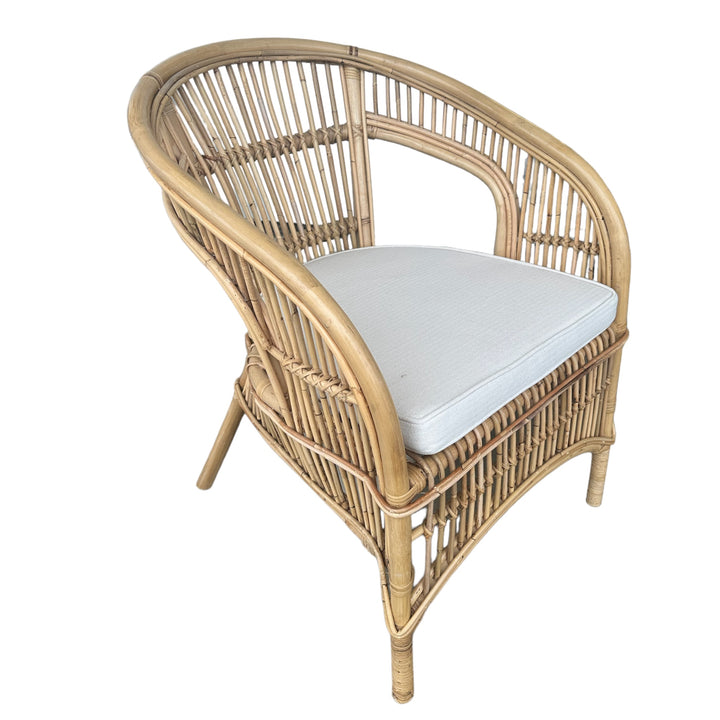 Natural cane/rattan dining or occasional chair. Hand crafted and suited for indoor or outdoor furniture use