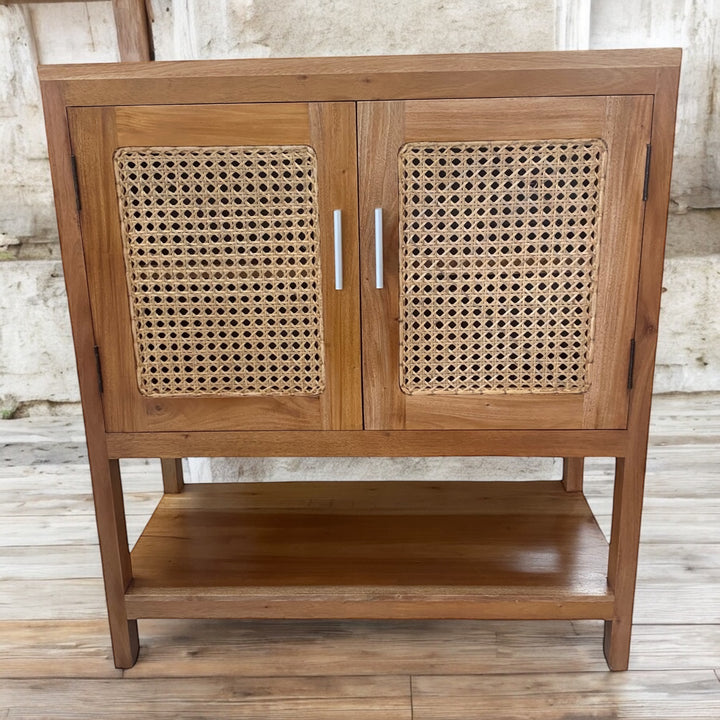 wooden cabinet with two doors featuring woven rattan mesh panels, offering a light and airy coastal-inspired look