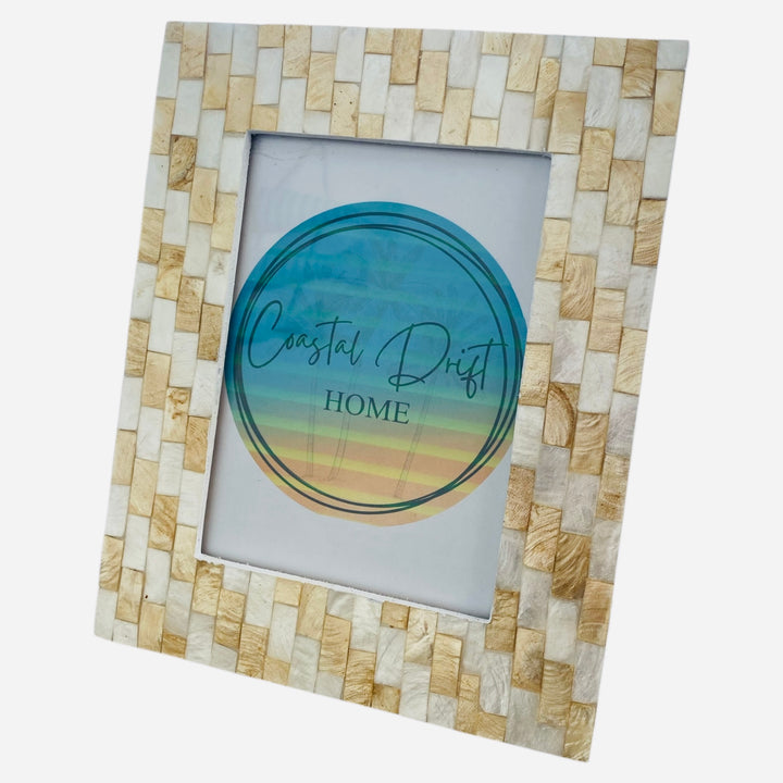 Decorative picture frame with mosaic design on a white background