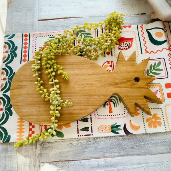 Pineapple shaped teak serving platter for charcuterie,cheese,fruits and appetizers. Tropical themed wooden board for entertaining.