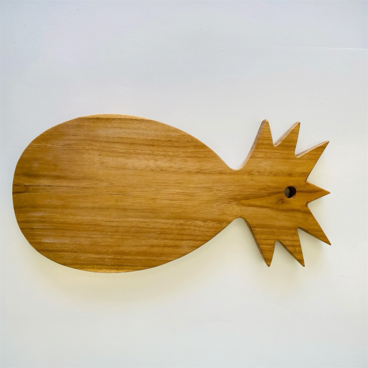 Pineapple shaped handcrafted teak serving platter for entertaining.
