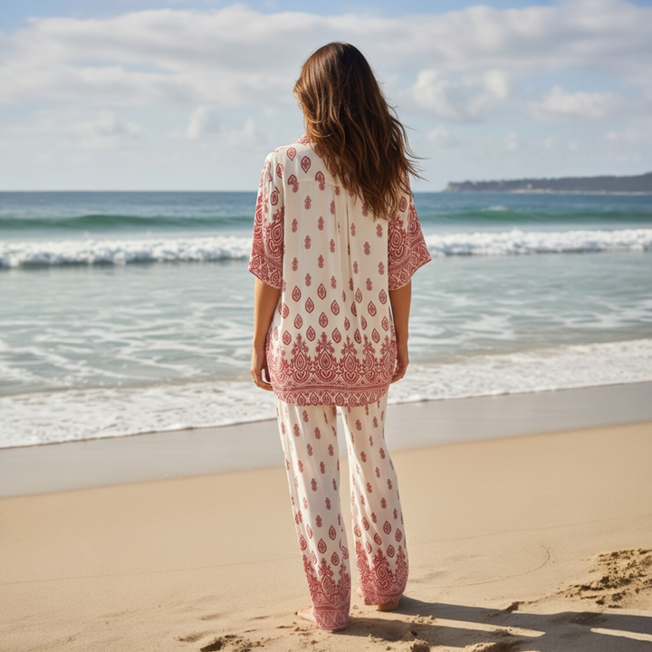 Lightweight rayon matching set with boho border print, photographed on the sand by the ocean at sunset