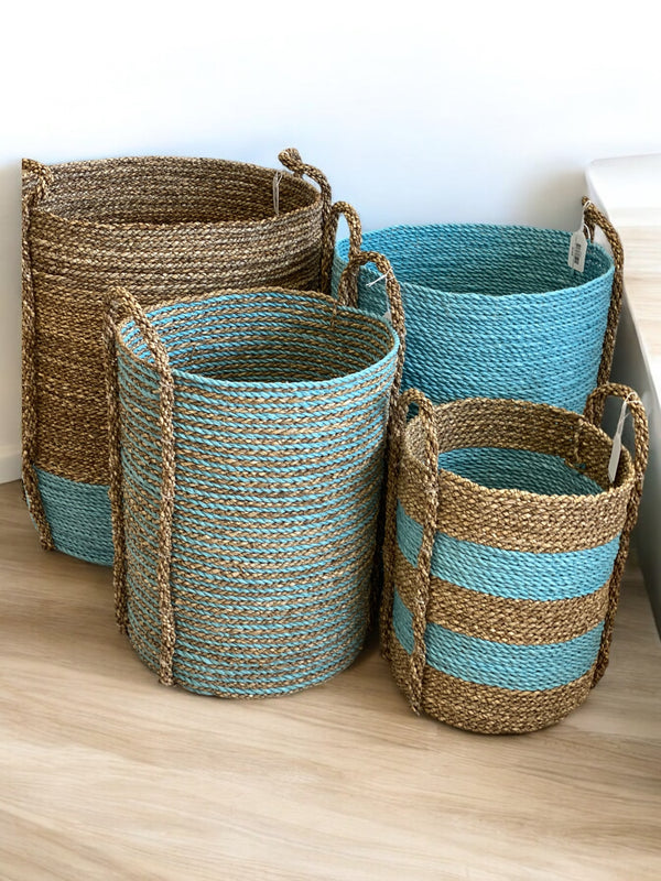 Sustainable seagrass and rope baskets with blue and natural stripes, perfect for stylish home organization
