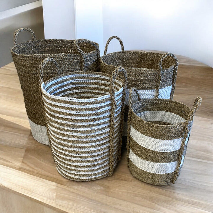 Natural and white striped seagrass and rope baskets. Perfect for a plant, washing basket or decorative storage solution. Hand crafted using natural sustainable products