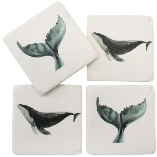 Set of four square coasters with whale designs on a white background