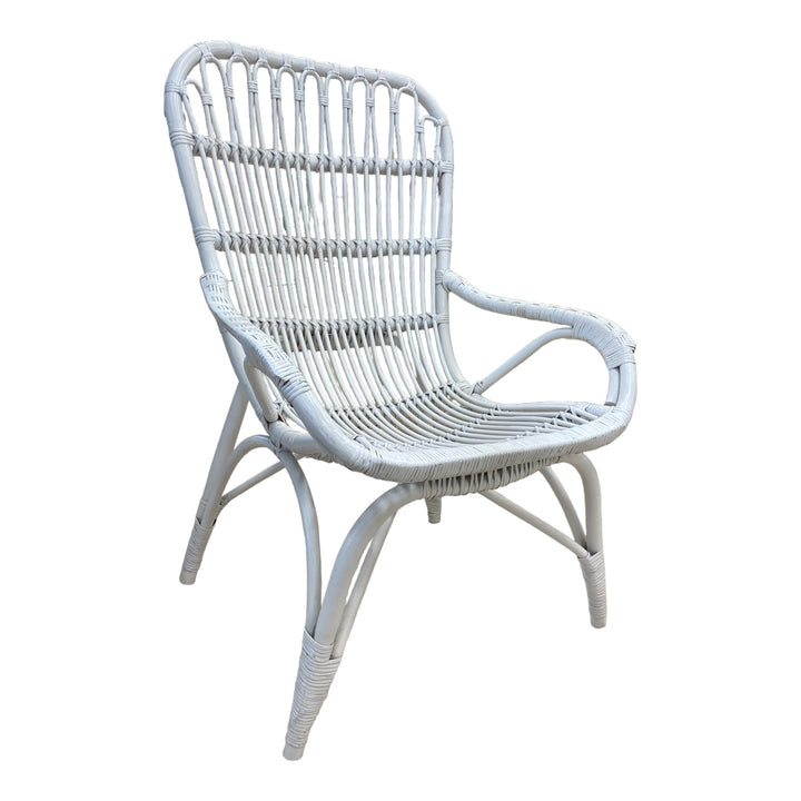 Lounge outdoors in comfort and style with this handcrafted white rattan outdoor chair