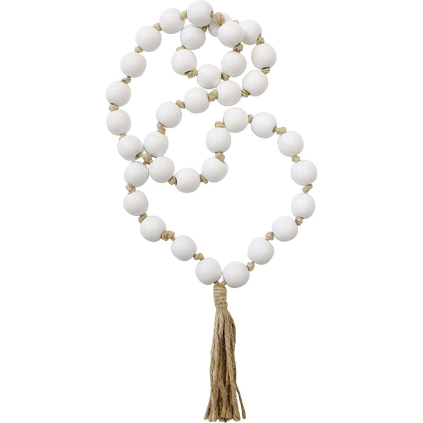 A decorative string of tassel loop beads elegantly displayed as home decor, adding texture and style to the space.