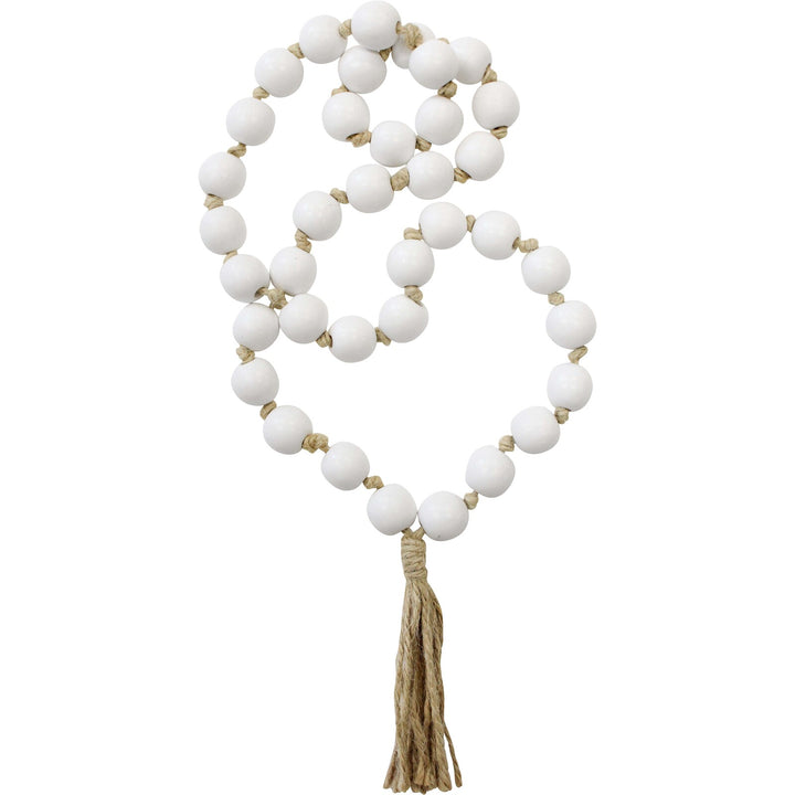 A decorative string of tassel loop beads elegantly displayed as home decor, adding texture and style to the space.