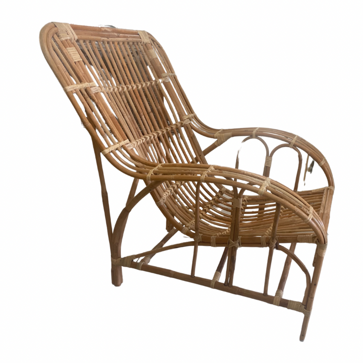 Natural hand crafted cane chair with lower profile. A lounger for the verandah
