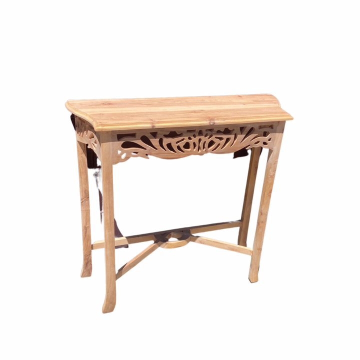 A compact white Semarang hall table with carved front design, made of mahogany timber, with a rectangular tabletop and a decorative leg base.
